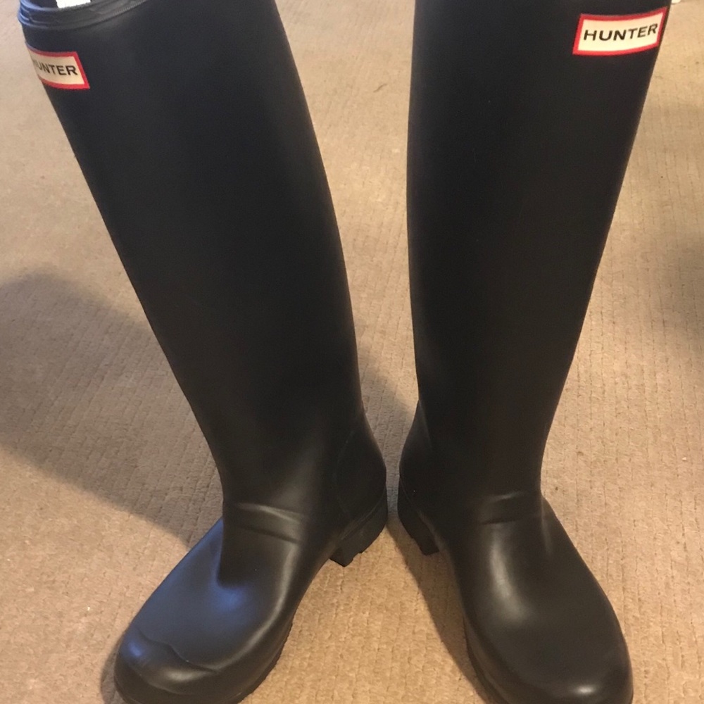 Hunter boots with teal socks.